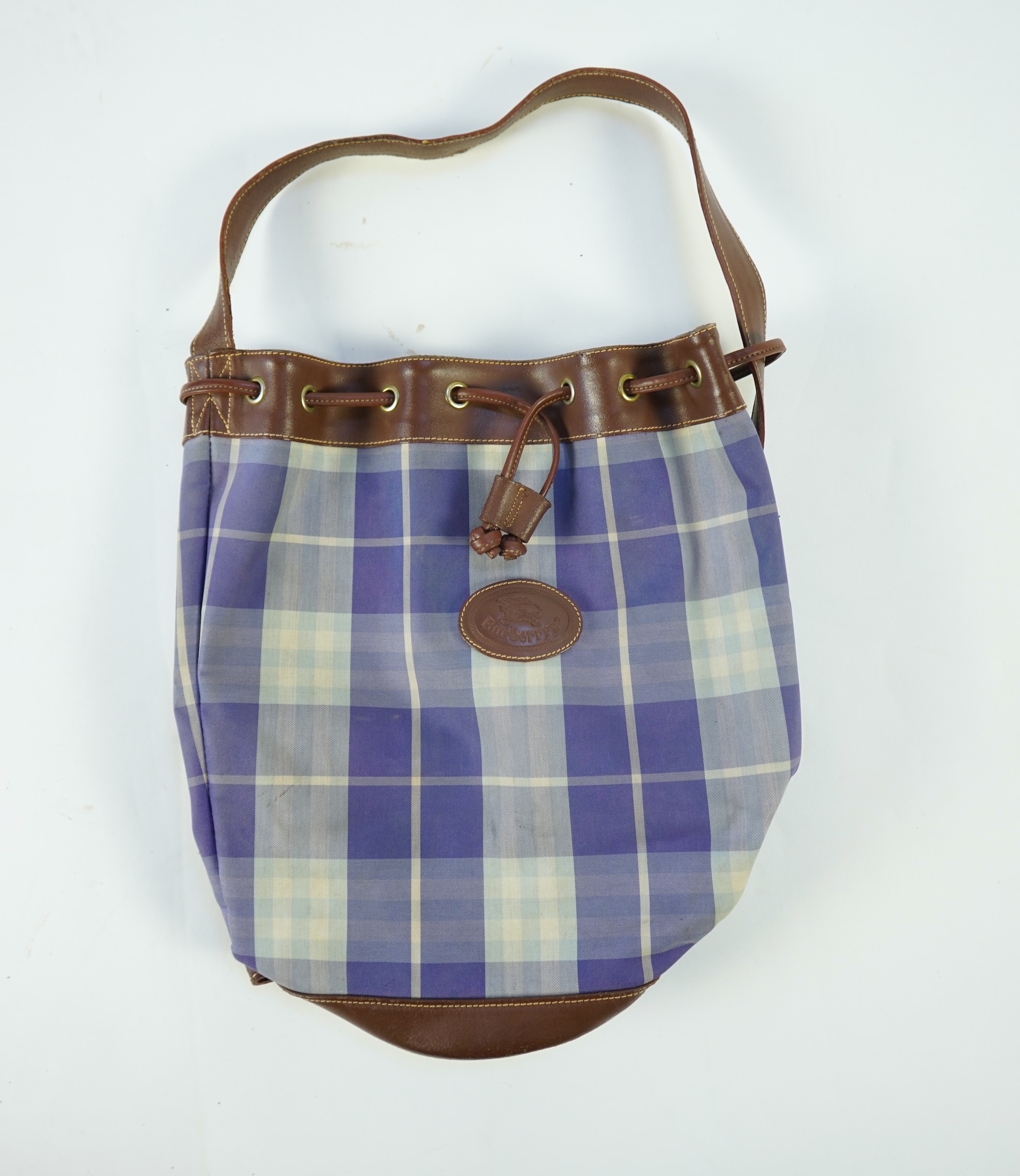 Two tartan canvas with leather trim Burberry bags, one backpack and one bucket bag